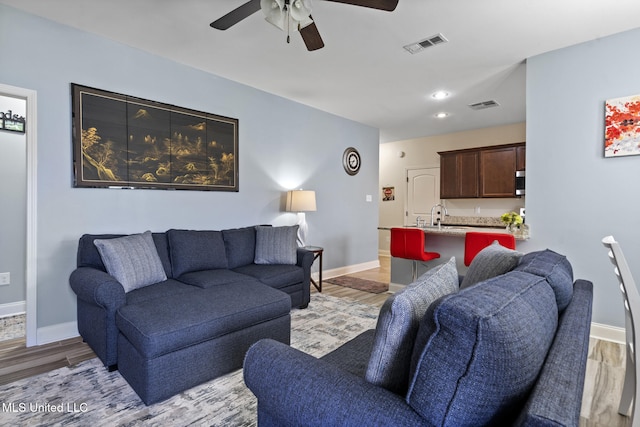 15035 Baylor Ave, Gulfport, MS 39503 - living room featuring a ceiling fan, light wood finished floors, baseboards, and recessed lighting