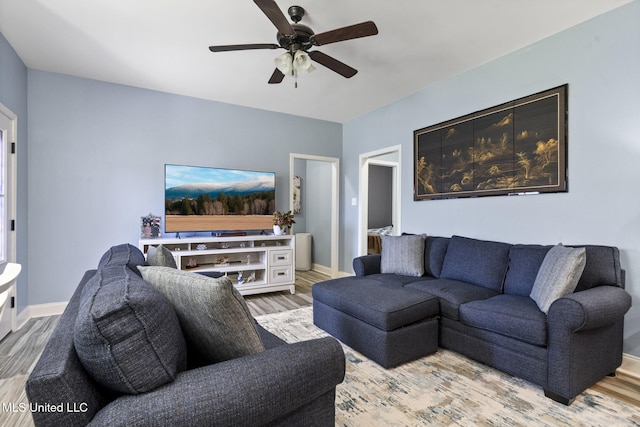 15035 Baylor Ave, Gulfport, MS 39503 - living area with a ceiling fan, wood finished floors, and baseboards