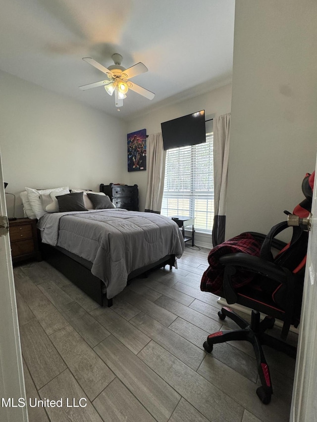 bedroom featuring ceiling fan and wood finished floors