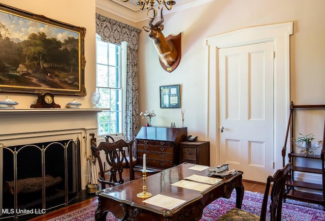 home office with wood-type flooring and crown molding