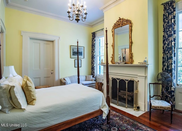 bedroom featuring crown molding, a chandelier, and wood-type flooring