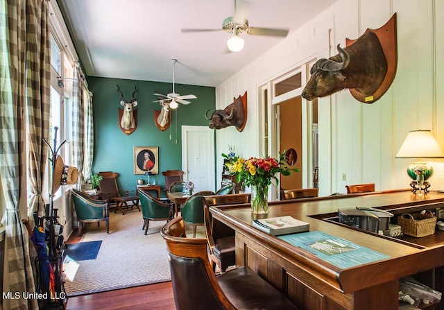 recreation room with wood-type flooring and ceiling fan