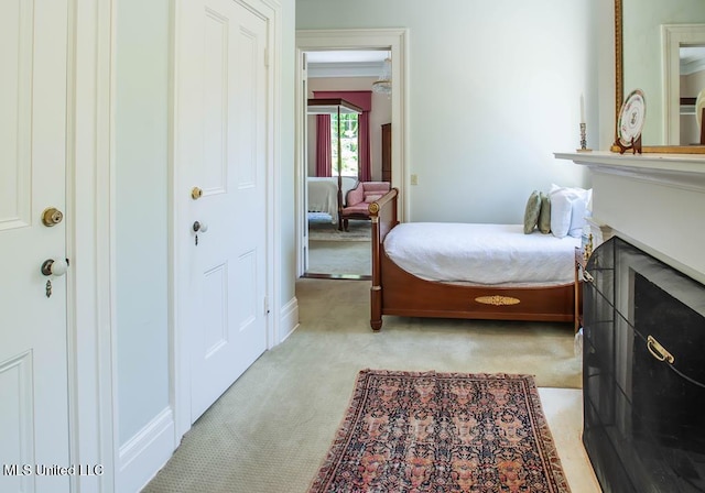 bedroom featuring light carpet