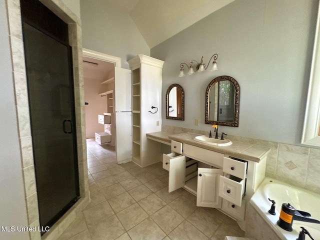 162 Lake Ridge Dr, Madison, MS 39110 - full bath with vaulted ceiling, tile patterned flooring, a shower stall, vanity, and a garden tub