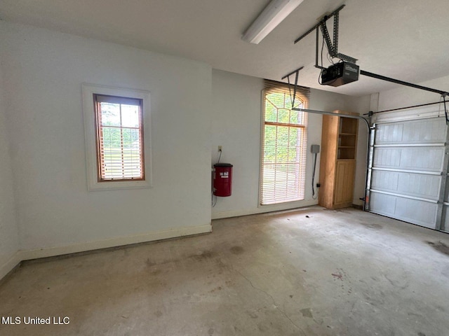 162 Lake Ridge Dr, Madison, MS 39110 - garage featuring a garage door opener and baseboards