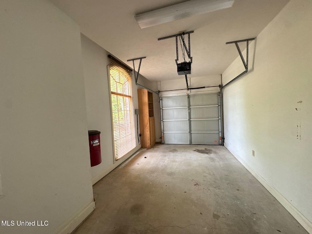 162 Lake Ridge Dr, Madison, MS 39110 - garage featuring a garage door opener and baseboards