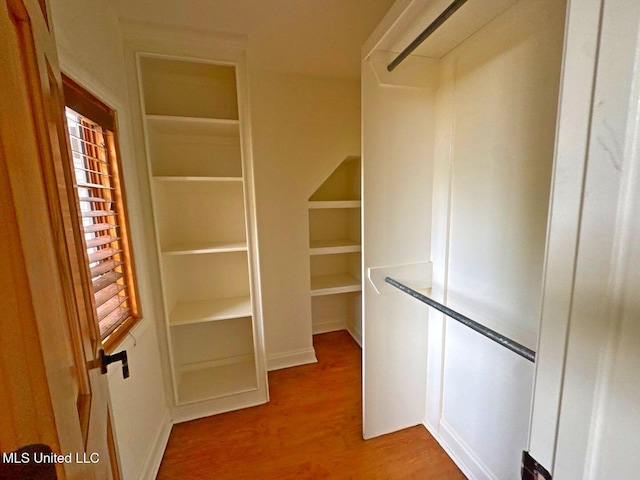 162 Lake Ridge Dr, Madison, MS 39110 - walk in closet with wood finished floors