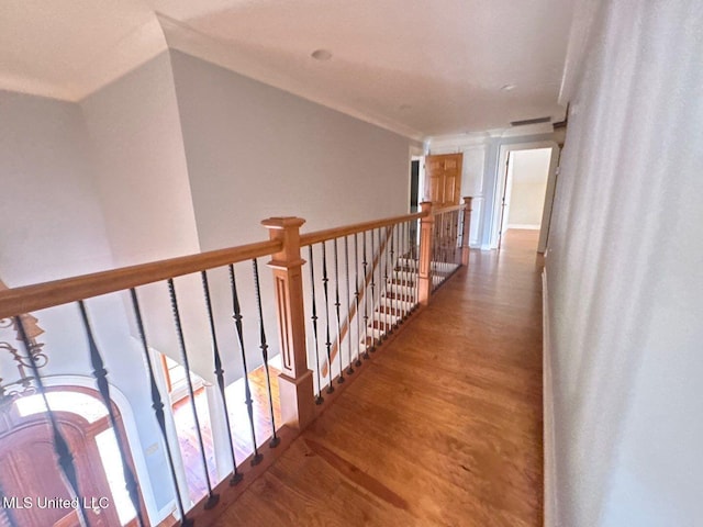 162 Lake Ridge Dr, Madison, MS 39110 - corridor featuring wood finished floors, an upstairs landing, and ornamental molding