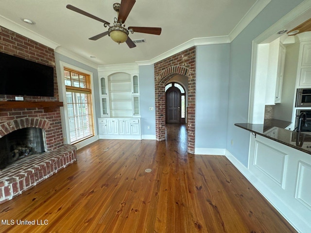 162 Lake Ridge Dr, Madison, MS 39110 - unfurnished living room with a fireplace, ceiling fan, dark wood-style flooring, ornamental molding, and baseboards