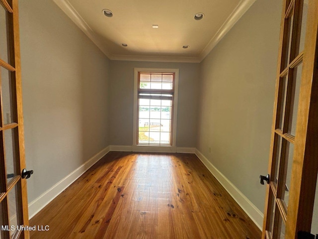 162 Lake Ridge Dr, Madison, MS 39110 - empty room with ornamental molding, wood-type flooring, baseboards, recessed lighting, and french doors