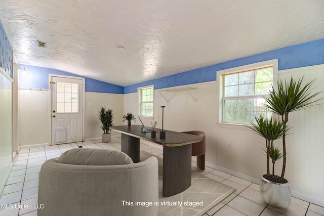 3217 N 2nd St, Ocean Springs, MS 39564 - tiled home office featuring vaulted ceiling and a textured ceiling