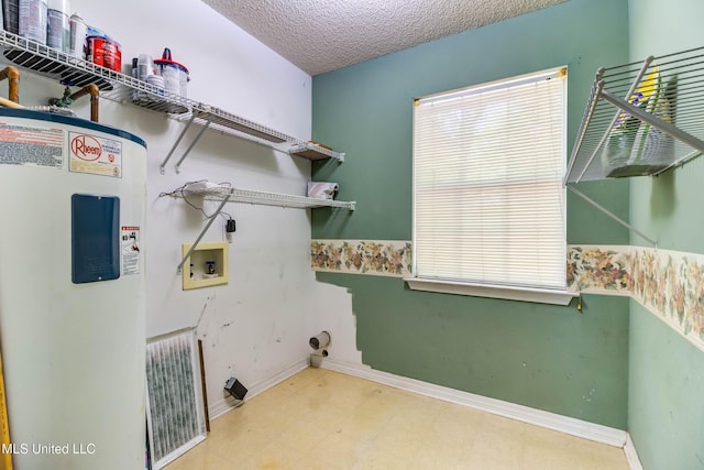 3217 N 2nd St, Ocean Springs, MS 39564 - washroom with water heater, washer hookup, a textured ceiling, baseboards, and tile patterned floors
