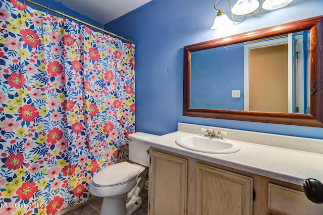 3217 N 2nd St, Ocean Springs, MS 39564 - full bathroom with vanity, toilet, and curtained shower