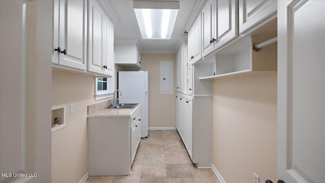 112 Eastgate Cir, Forest, MS 39074 - washroom with cabinet space, hookup for a washing machine, and ornamental molding