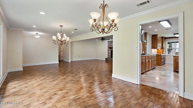 112 Eastgate Cir, Forest, MS 39074 - spare room with a chandelier, crown molding, light wood finished floors, a brick fireplace, and recessed lighting