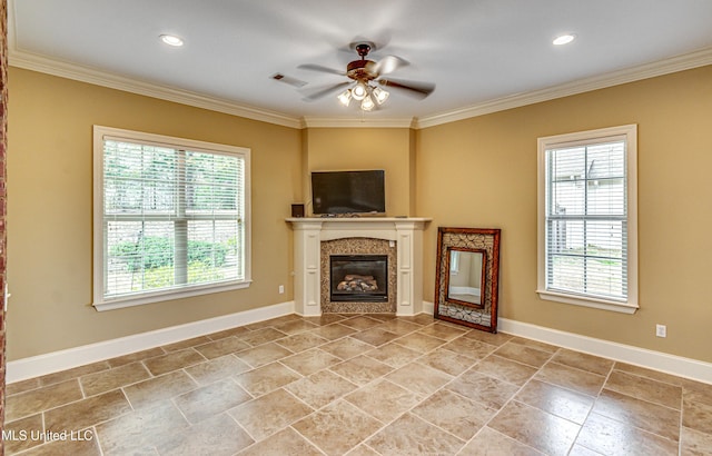 unfurnished living room with a wealth of natural light, ornamental molding, and visible vents