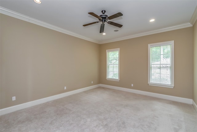 spare room featuring light carpet, baseboards, crown molding, and recessed lighting