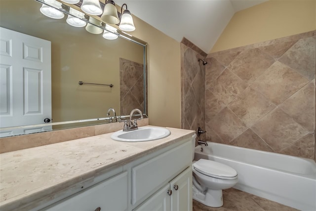 full bathroom with shower / bath combination, toilet, vaulted ceiling, vanity, and tile patterned flooring