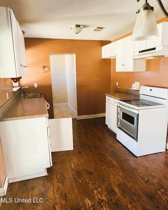 kitchen featuring dark hardwood / wood-style flooring, white cabinetry, white range with electric cooktop, and sink