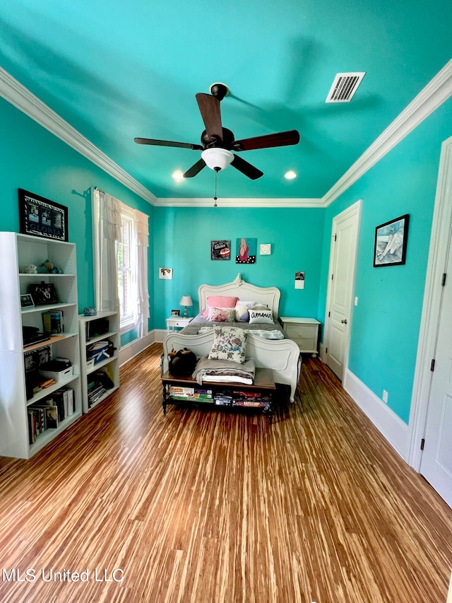 bedroom featuring crown molding, ceiling fan, and light hardwood / wood-style floors