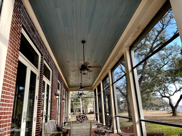 unfurnished sunroom with wooden ceiling