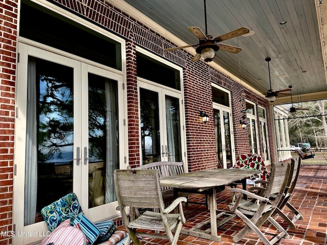 view of patio featuring french doors and ceiling fan