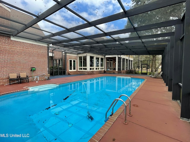 view of pool featuring a lanai and a patio area