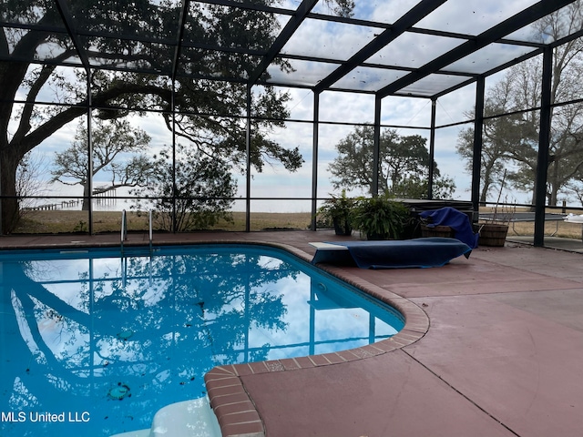 view of pool with a lanai and a patio area