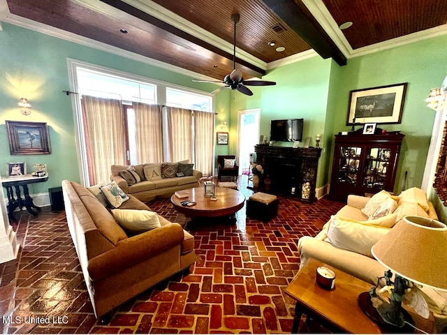 living room featuring beam ceiling, crown molding, wooden ceiling, and ceiling fan