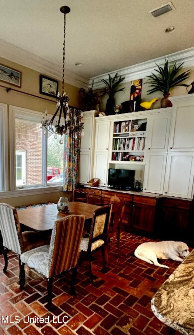 dining area featuring ornamental molding