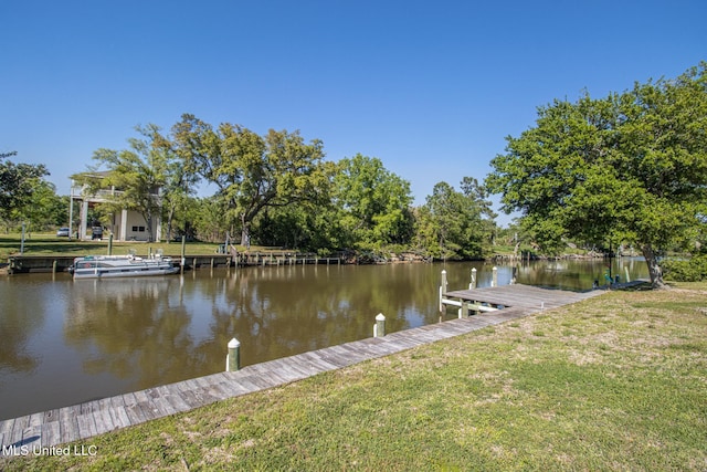 dock area featuring a yard and a water view