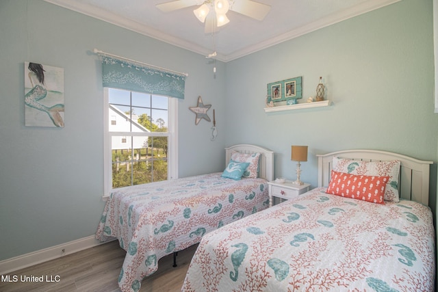 bedroom featuring a ceiling fan, wood finished floors, baseboards, and ornamental molding