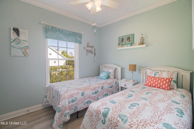 bedroom with a ceiling fan, wood finished floors, baseboards, and ornamental molding