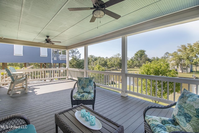 wooden terrace featuring ceiling fan