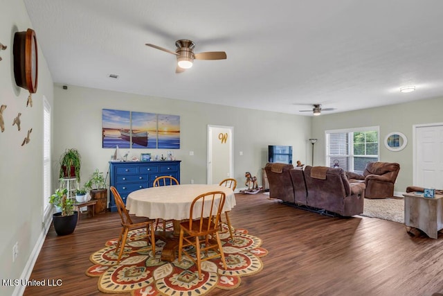 10714 Lilinoe Way, Diamondhead, MS 39525 - dining room featuring baseboards, a ceiling fan, visible vents, and dark wood-style flooring
