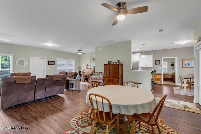 10714 Lilinoe Way, Diamondhead, MS 39525 - dining area with ceiling fan, a wealth of natural light, dark wood-style floors, and visible vents