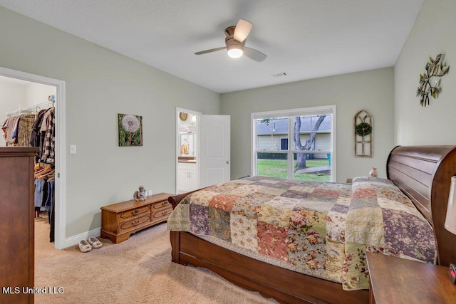 10714 Lilinoe Way, Diamondhead, MS 39525 - bedroom with visible vents, light carpet, a walk in closet, a closet, and baseboards