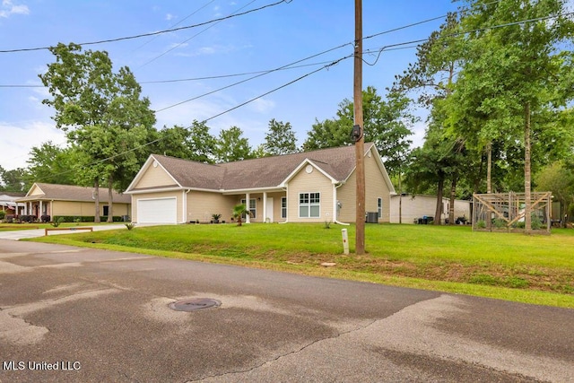 10714 Lilinoe Way, Diamondhead, MS 39525 - ranch-style house with driveway, a front yard, cooling unit, and a garage