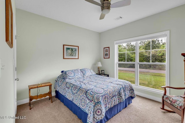 10714 Lilinoe Way, Diamondhead, MS 39525 - bedroom featuring carpet floors, visible vents, baseboards, and ceiling fan