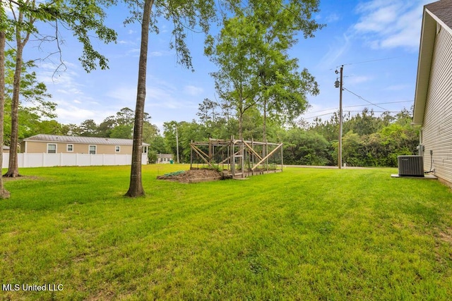 10714 Lilinoe Way, Diamondhead, MS 39525 - view of yard featuring central AC and fence