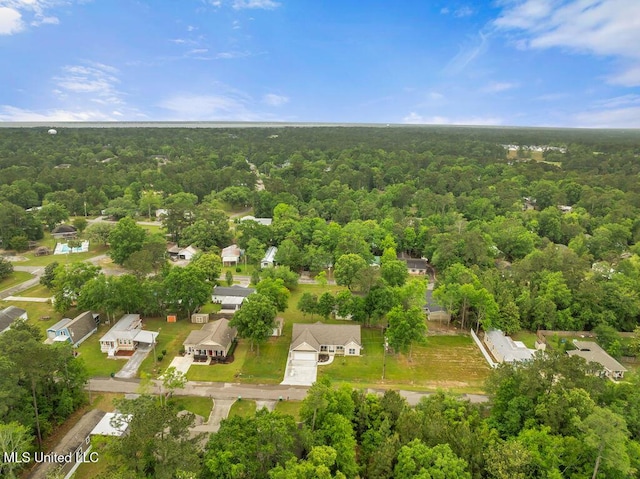 10714 Lilinoe Way, Diamondhead, MS 39525 - drone / aerial view featuring a residential view and a wooded view