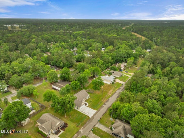 10714 Lilinoe Way, Diamondhead, MS 39525 - drone / aerial view featuring a wooded view