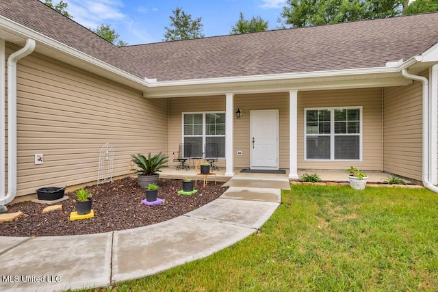 10714 Lilinoe Way, Diamondhead, MS 39525 - entrance to property featuring a yard, roof with shingles, and covered porch