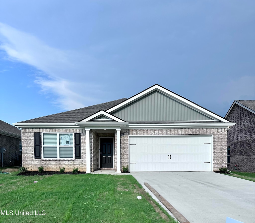 single story home featuring brick siding, concrete driveway, an attached garage, board and batten siding, and a front lawn