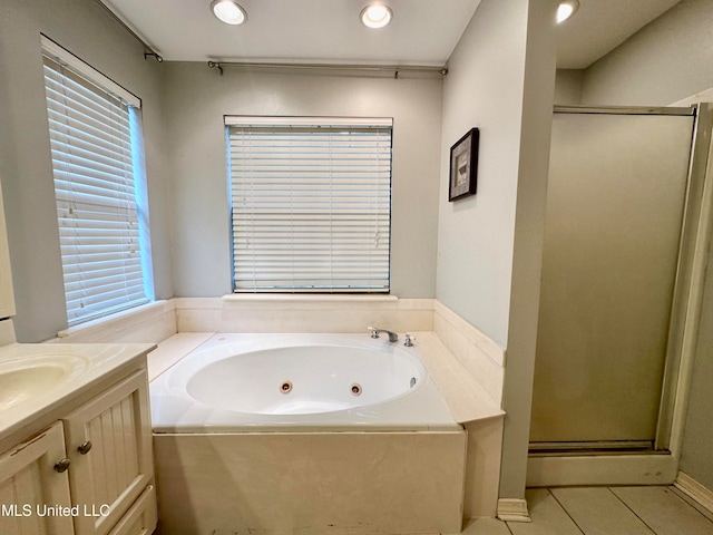 bathroom with vanity, tile patterned floors, and independent shower and bath