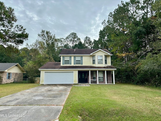 view of front of house featuring a front yard and a garage