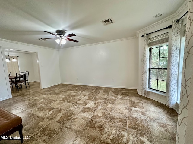 spare room featuring crown molding and ceiling fan