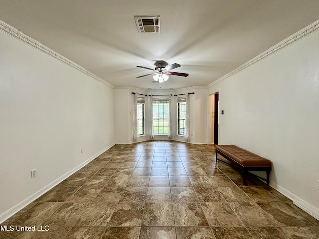 empty room with ornamental molding and ceiling fan