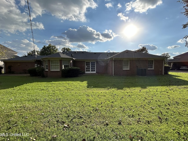 507 Reed Dr, Cleveland, MS 38732 - rear view of house with brick siding and a lawn