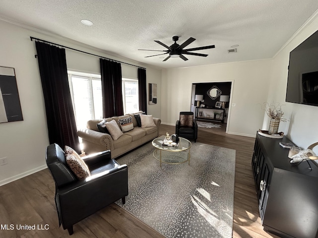 507 Reed Dr, Cleveland, MS 38732 - living room with wood finished floors, a textured ceiling, ceiling fan, baseboards, and ornamental molding